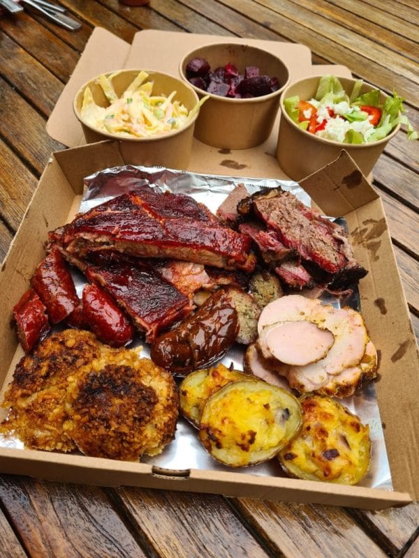 An image of a tray of barbecued foods.
