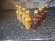 Image showing a row of two sauce bottles. Lynton Mustard on the left, Barbrook BBQ on the right. Both bottles show the Exmoor BBQ logo.